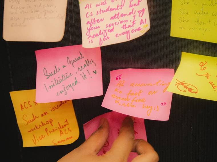 Sticky notes covered in ideas written during a Session 6 exercise